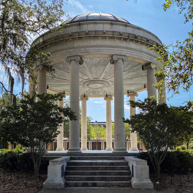 Classical domed bandstand framed by trees in New Orleans City Park