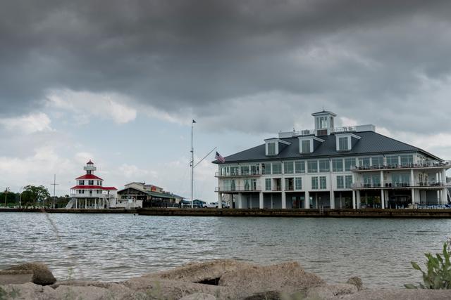 New Canal Lighthouse on Lake Pontchartrain under storm clouds