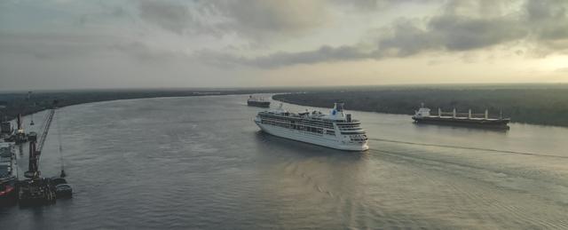 Ships on the Mississippi River at dusk near New Orleans
